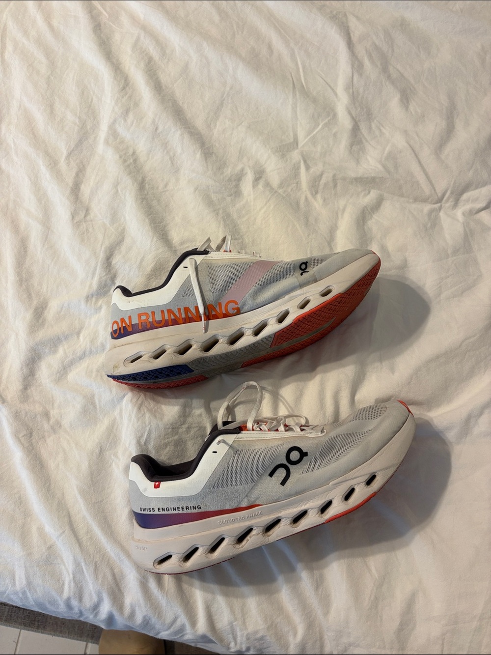 On Running Mens White Sneakers with Orange Accents